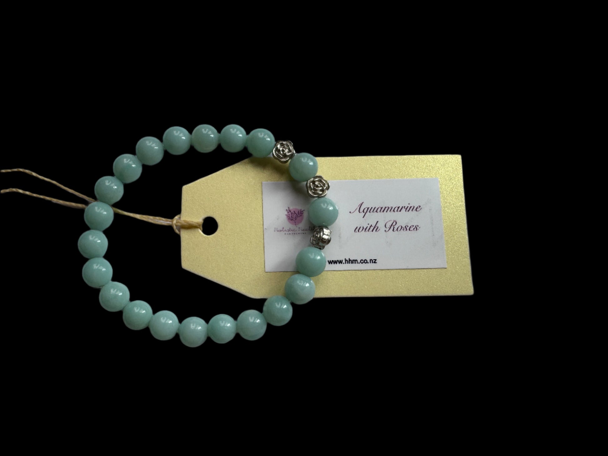 A handmade Aquamarine crystal bracelet with silver-coloured roses.